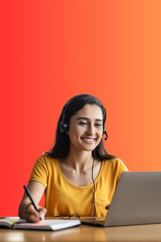 A student in a headset at a laptop, on the Business English course card